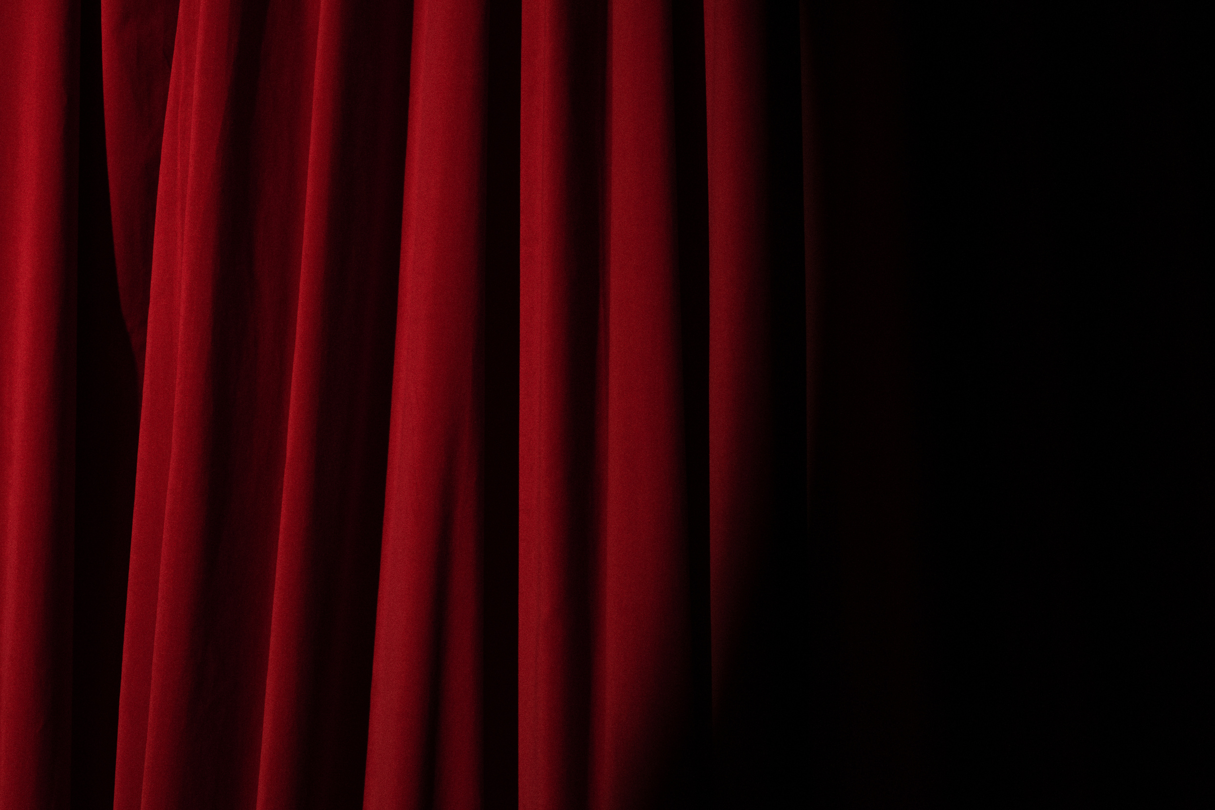 Spotlight on a Red Curtain
